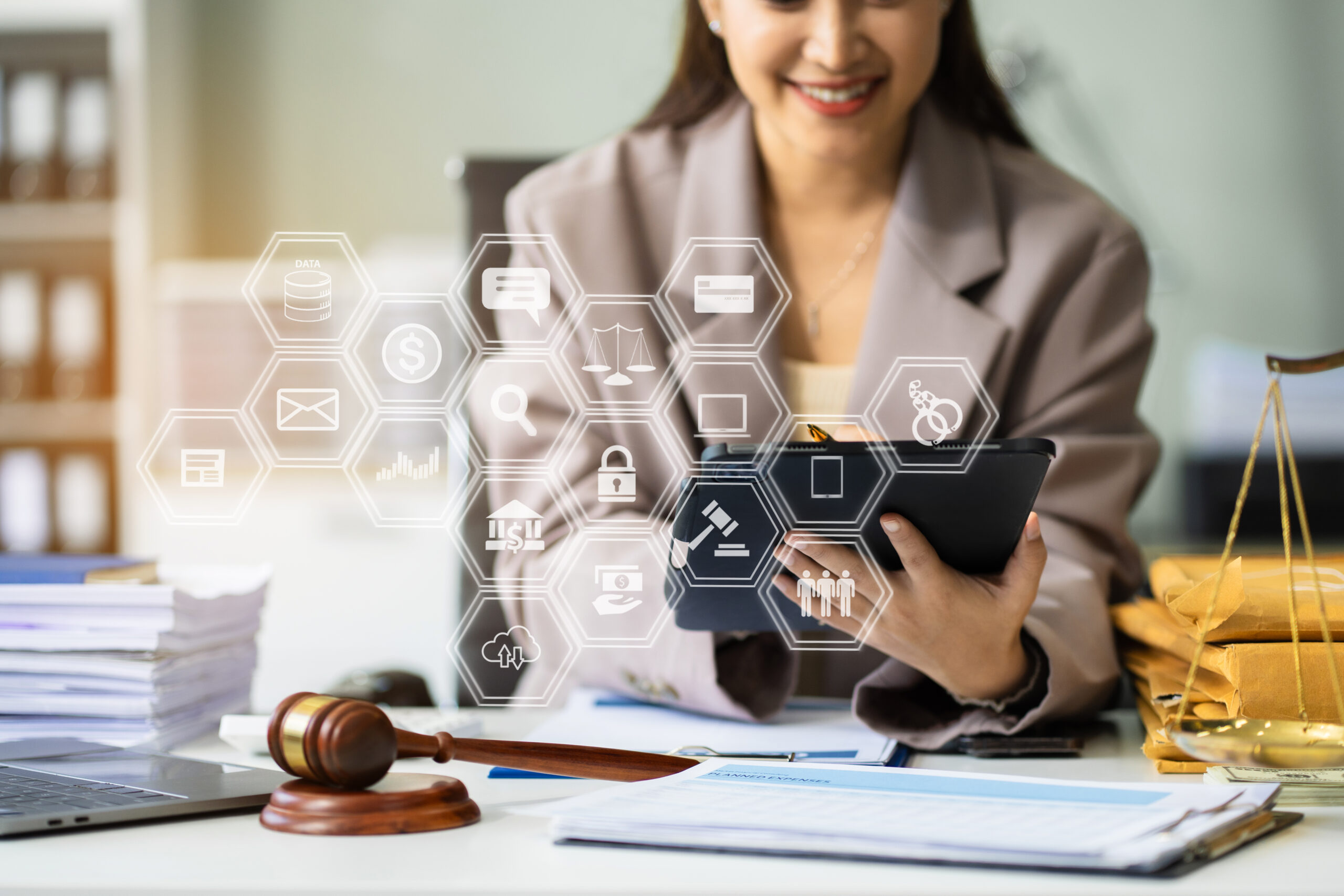 justice and law concept.Male judge in a courtroom the gavel, wor justice and law concept.Male judge in a courtroom the gavel, working with digital tablet computer on wood table in sun light.